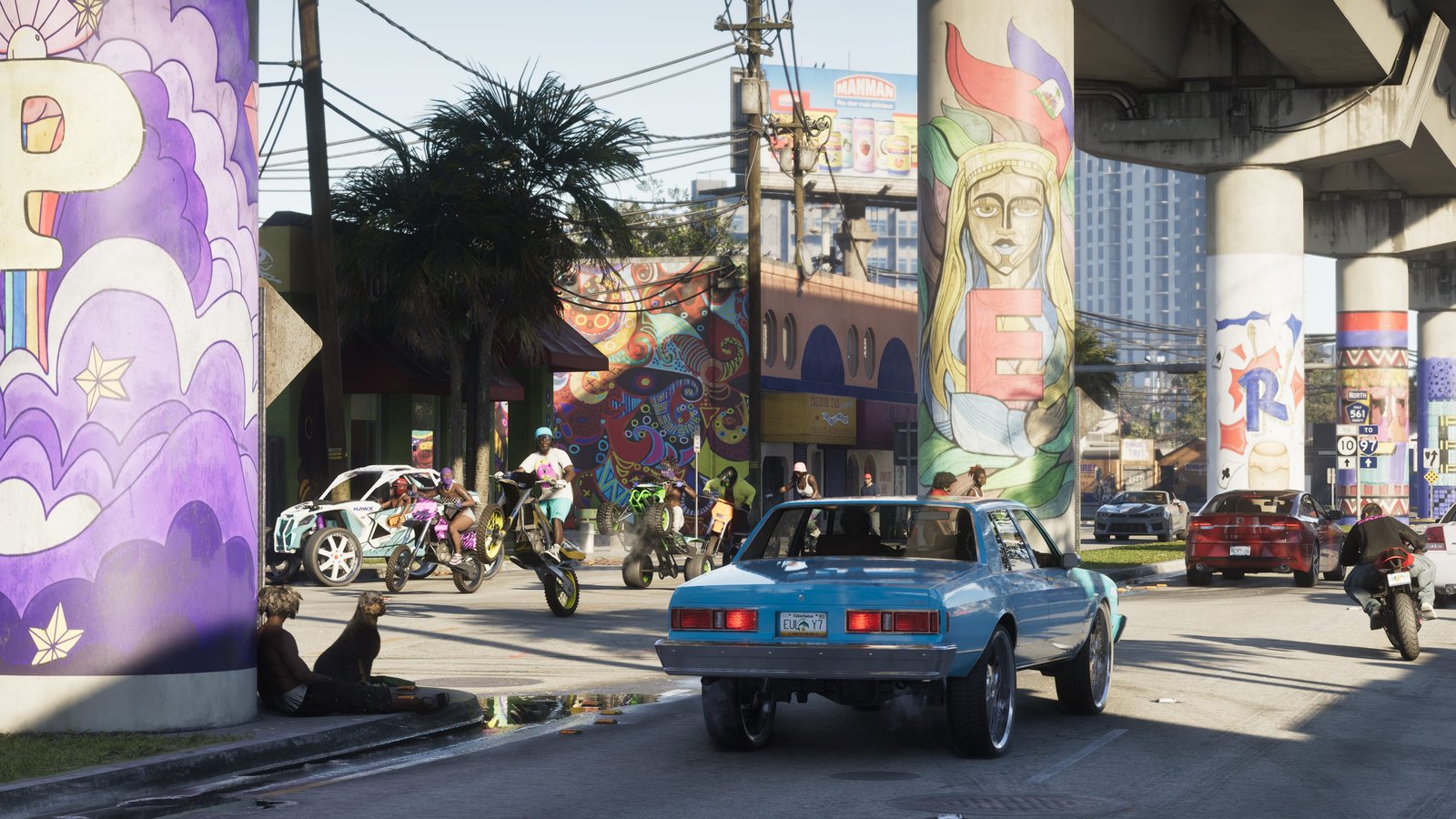 Under the overpass in Vice City: murals, palms and a lowered sedan.